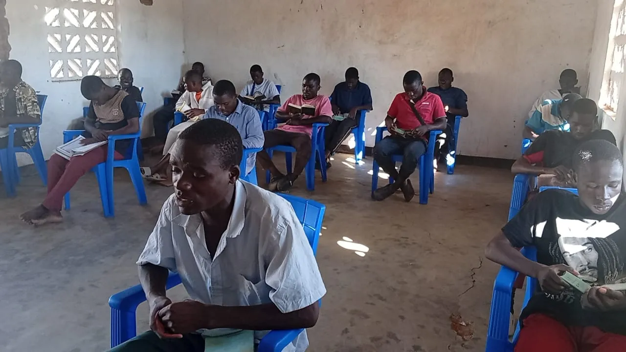 Students reading the Qur'an together during a lesson.